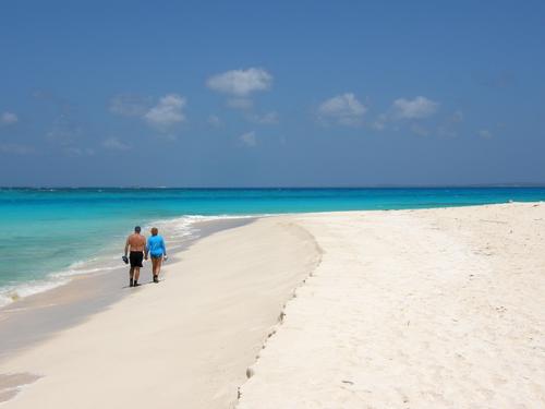 tourists on the beach at Prickly Pear island near St. Martin in the Bahamas