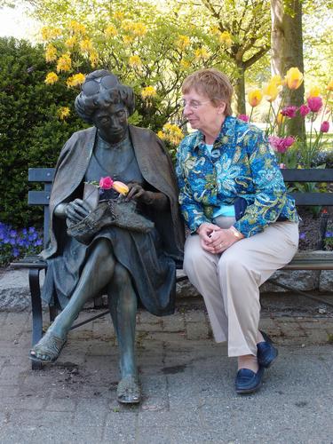 Betty Lou joins a seated-woman statue in Vancouver at British Columbia in Canada