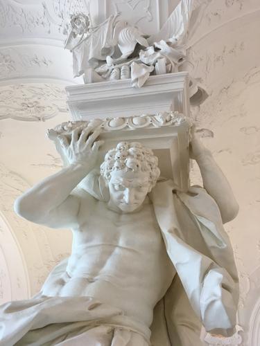 human statue pretending to support a column in Belvedere Palace at Vienna, Austria