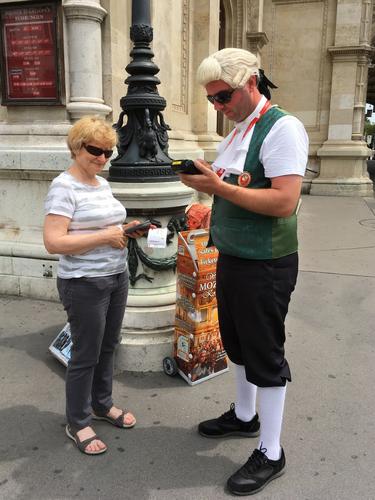 Andee purchases tickets for a Mozart concert in Vienna, Austria