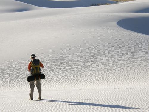 backpacker on the way to a wilderness campsite at White Sands National Monument in New Mexico