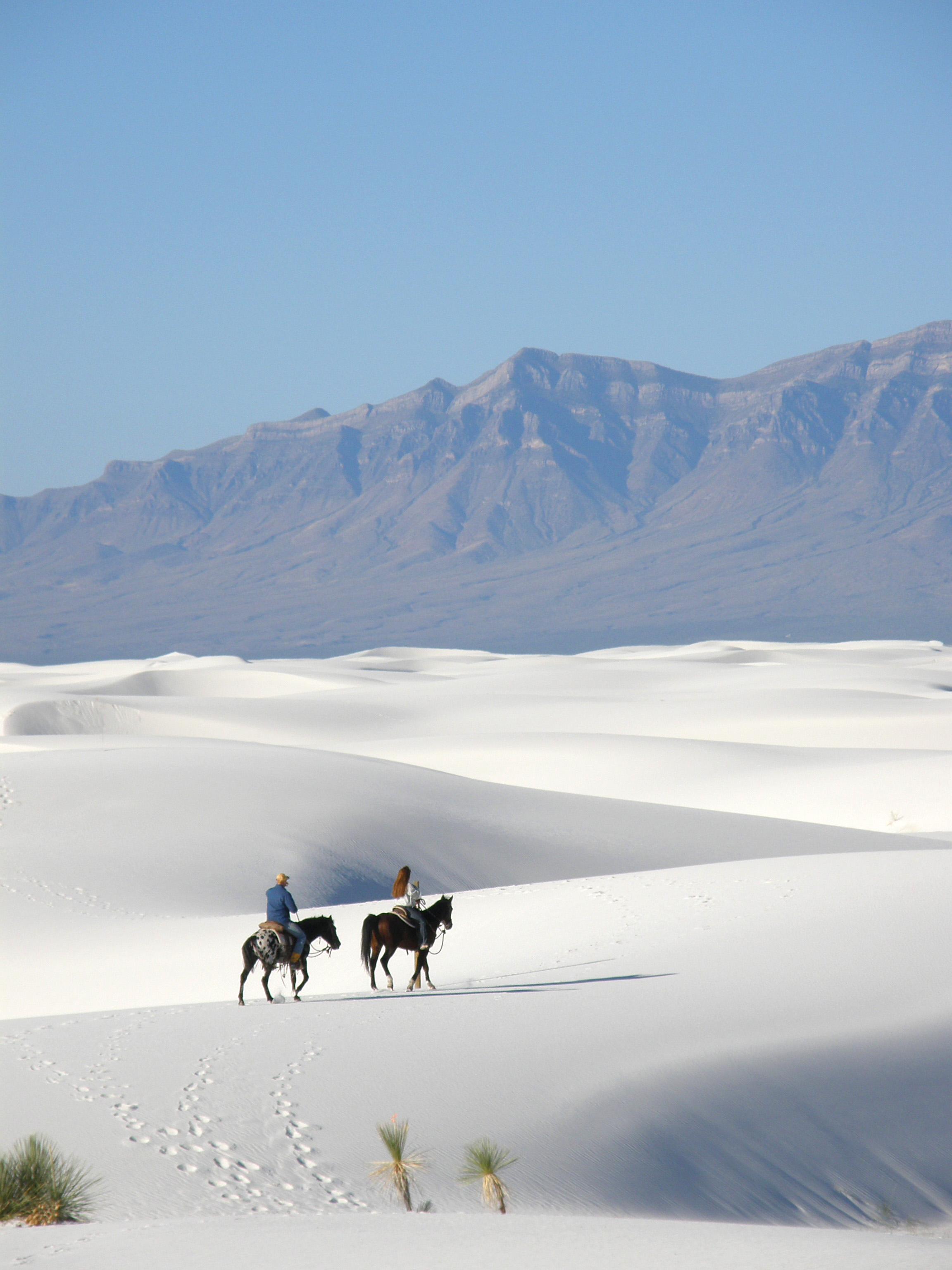 horseback riders at White Sands National Monument in New Mexico
