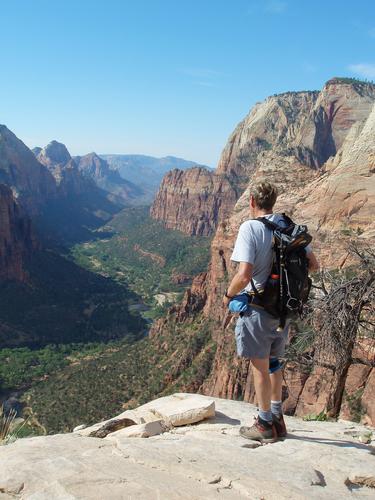 hiker and view atop Angels Landing at Zion National Park in Utah