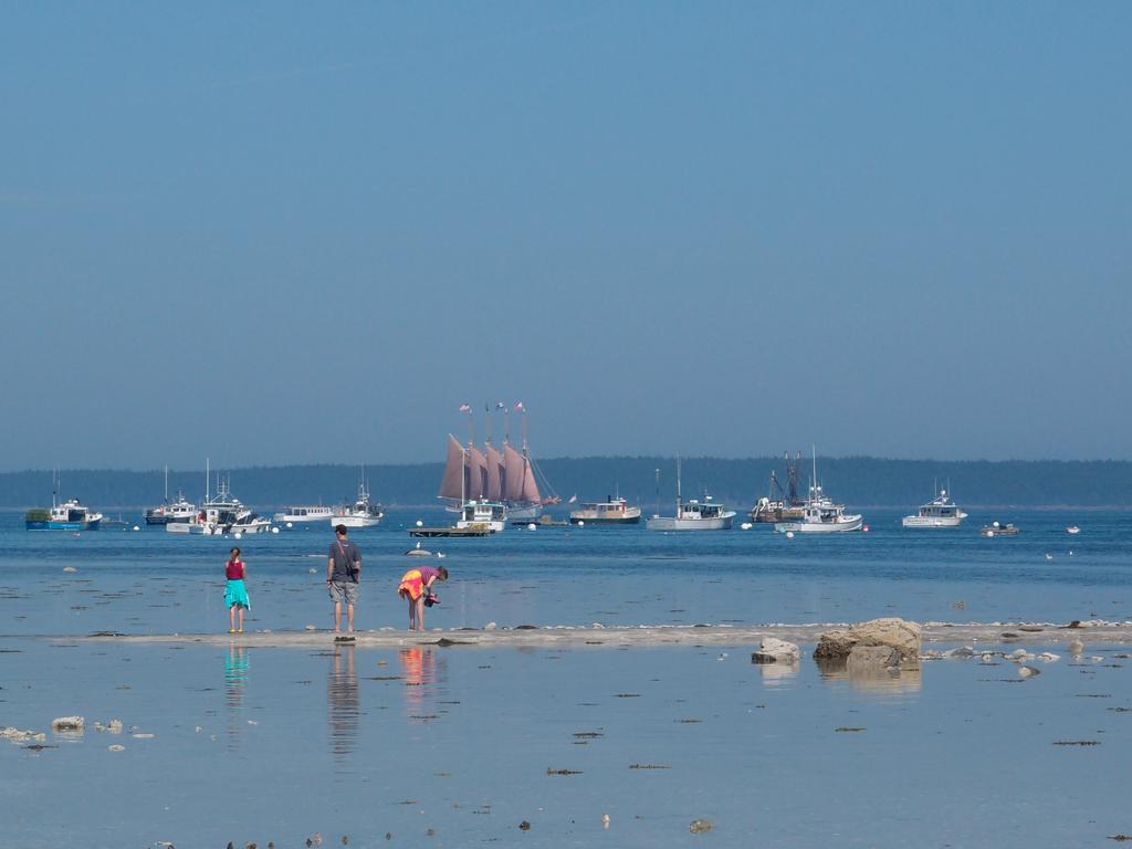 tourists at low tide out on the famous sandbar at Bar Harbor in Maine