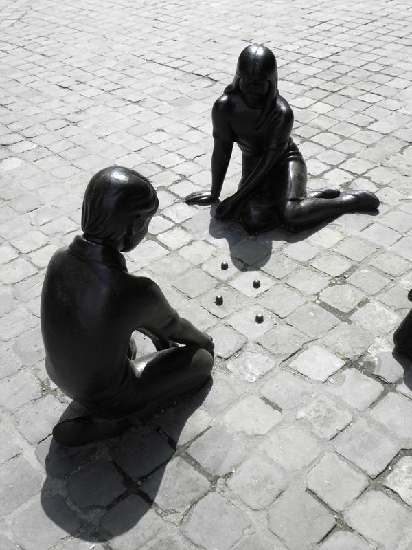 statues on the plaza at Huy in Belgium