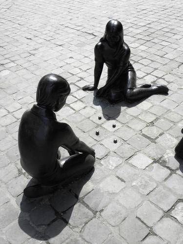 statues on the plaza at Huy in Belgium