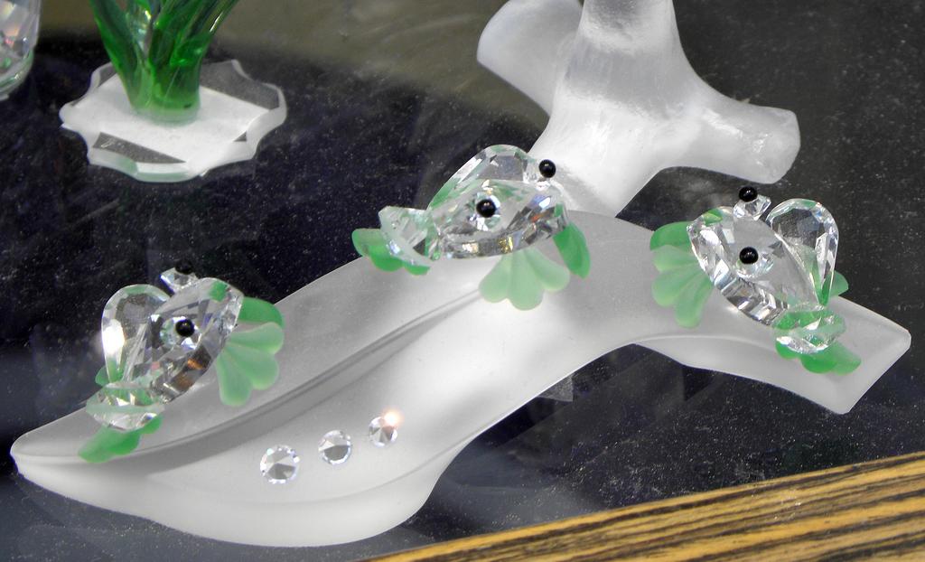 trio of crystal-glass frogs