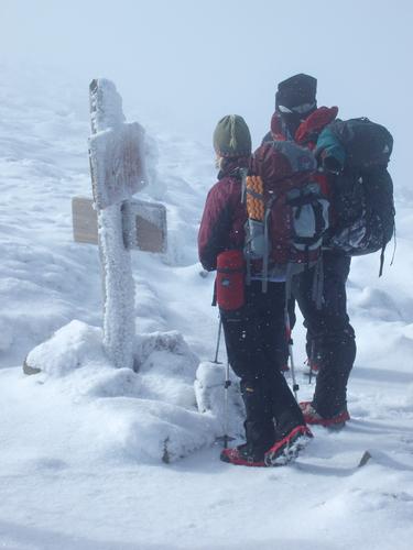 winter hikers at a trail junction on the way to Mount Adams in New Hampshire