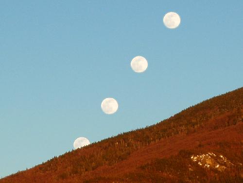 multiple-exposure moonrise from Artist's Bluff in New Hampshire