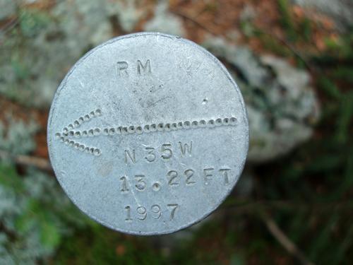 metal survey marker on Black Mountain in New Hampshire