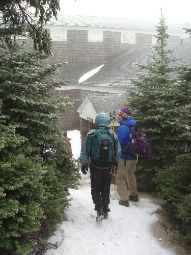 hikers approaching Cannon Mountain summit building in New Hampshire