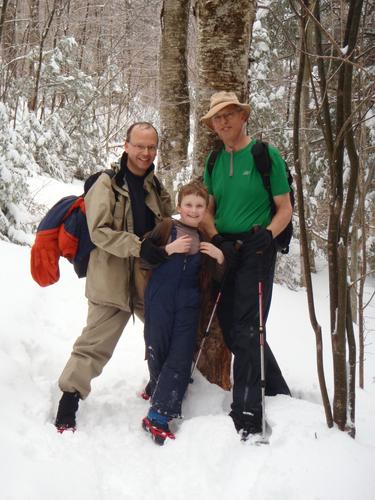 winter hikers on the trail to Mount Cardigan in New Hampshire