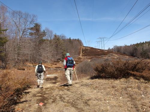 Dick and John walk a powerline swath on a bushwhack to Dickinson Hill and Page hill in New Hampshire