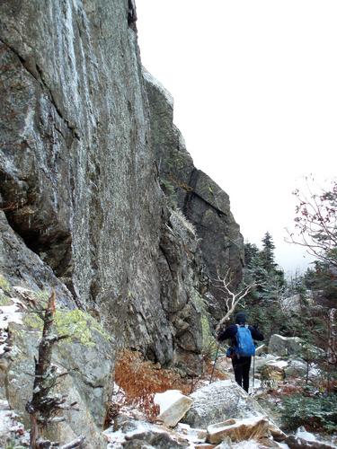 hiker on the Greenleaf Trail to Eagle Cliff in New Hampshire