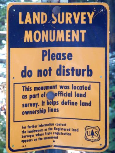 survey marker on Mount Evans in New Hampshire