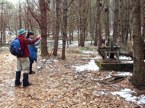 John and Elaine photograph an old ski lift motor alongside the trail to Mount Grace in north-central Massachusetts