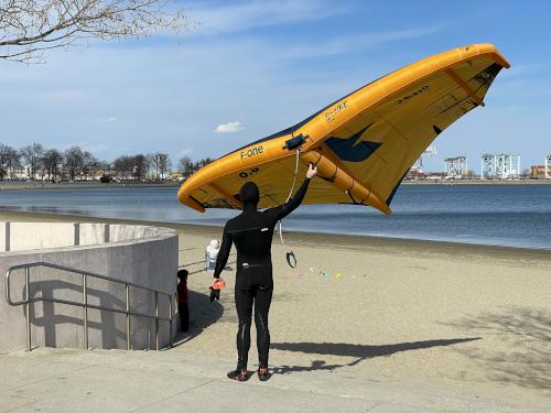 sailboarder in February at Boston Harborwalk in Massachusetts