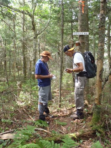 hikers at the summit of Jeffers Mountain in New Hampshire