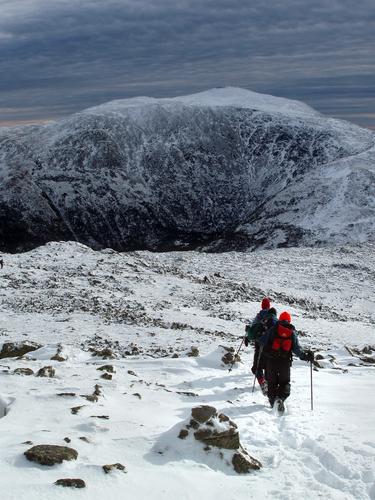 winter hikers head down the Gulfside Trail toward Sphinx Col and Mount Washington in New Hampshire