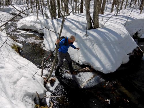 Fred crossing a stream on the way to Kimball Hill in New Hampshire