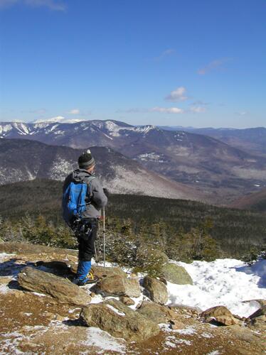 Dick takes in the summit view in March from Mount Liberty in New Hampshire
