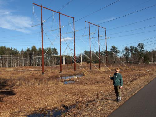 Andee stands in the powerline swath on the Londonerry Rail Trail in southern New Hampshire