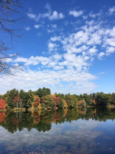 classic fall scene in October at Mine Falls Park in New Hampshire