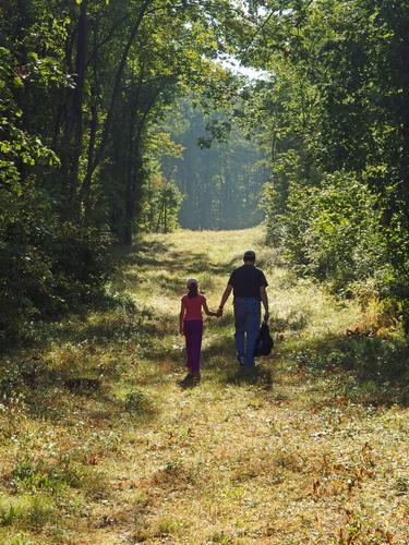 Talia and David head up an old woods road on the way to Mine Hill in southern New Hampshire