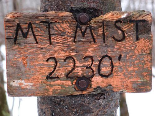 summit sign atop Mount Mist in New Hampshire