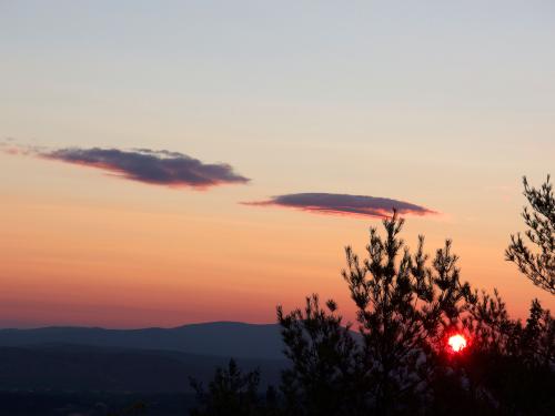 sunset in July as seen from the fire tower atop Oak Hill near Concord in New Hampshire