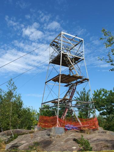 summit fire tower under repair atop Pawtuckaway South Mountain in New Hampshire