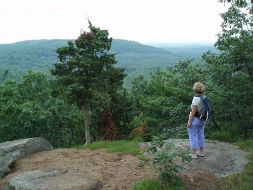 hiker on Pawtuckaway North Mountain in New Hampshire