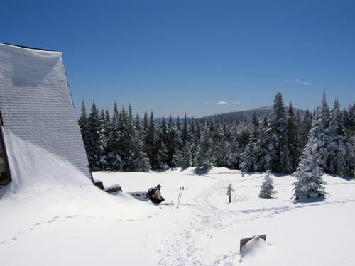 Chuck stops in April beside AMC's Mispah Spring Hut ond the hike down from Mount Pierce in New Hampshire