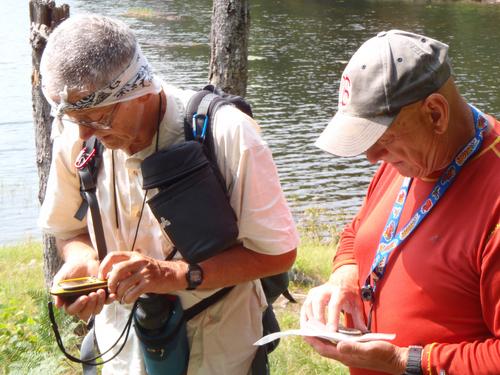 hikers at Halfmile Pond preparing to bushwhack on to Prospect Hill in Enfield in New Hampshire