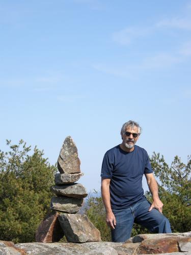 cairn builder atop Rose Mountain in New Hampshire