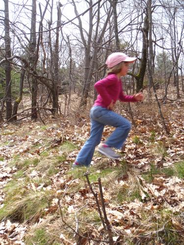 young hiker on the way up Rose Mountain in New Hampshire