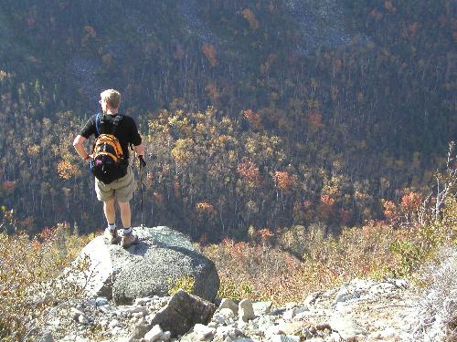 hiker and view from the trail to Mount Spaulding in Maine