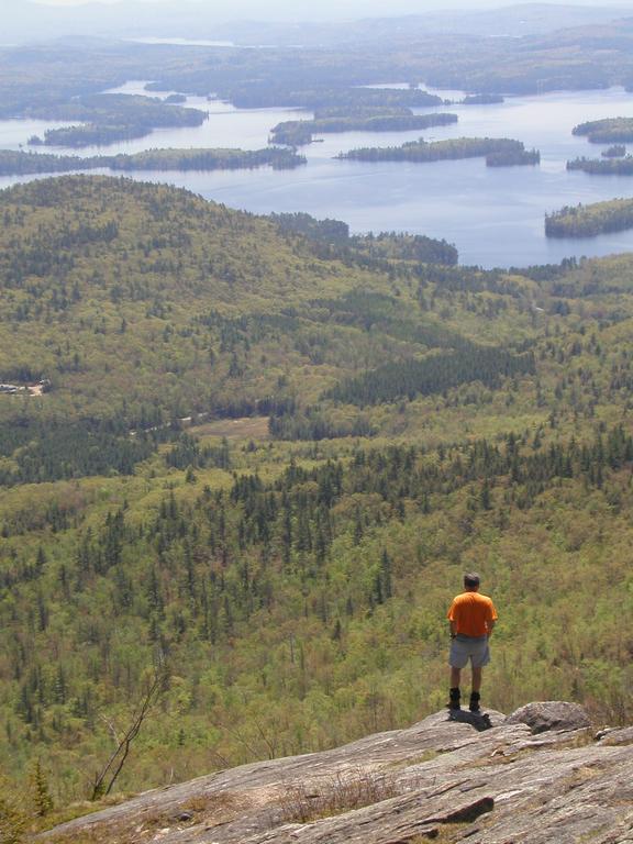 hiker and view from Mount Percival in New Hampshire