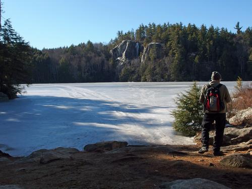 Lance checks the view of pond and cliff from the boat lauch at Stonehouse Pond in southeastern New Hampshire