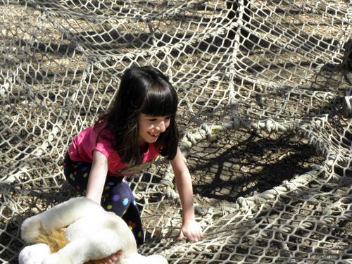 visitor on the rope sider web at Stone Zoo in Massachusetts