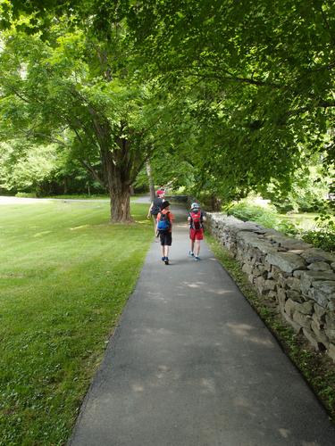 hikers head up the Faulkner Trail to Mount Tom at Woodstock in Vermont