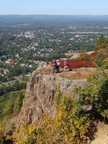 John, Elaine and Gwen stand near the edge of the Metacomet-Monadnock Trail to Mount Tom in Massachusetts