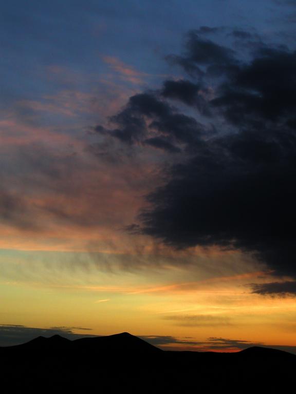 sunset in November over the Tripyramids as seen from Mount Tremont in New Hampshiree
