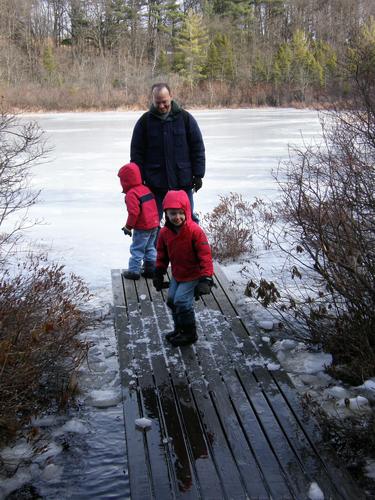 hikers on the Bog Trail at Ward Reservation in Massachusetts