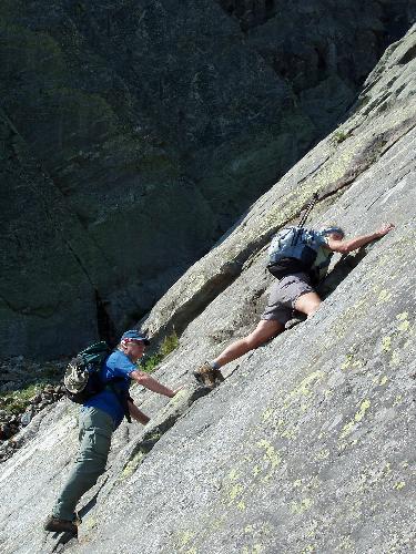 hikers ascending a scary section of the Huntington Ravine Trail to Mount Washington in New Hampshire